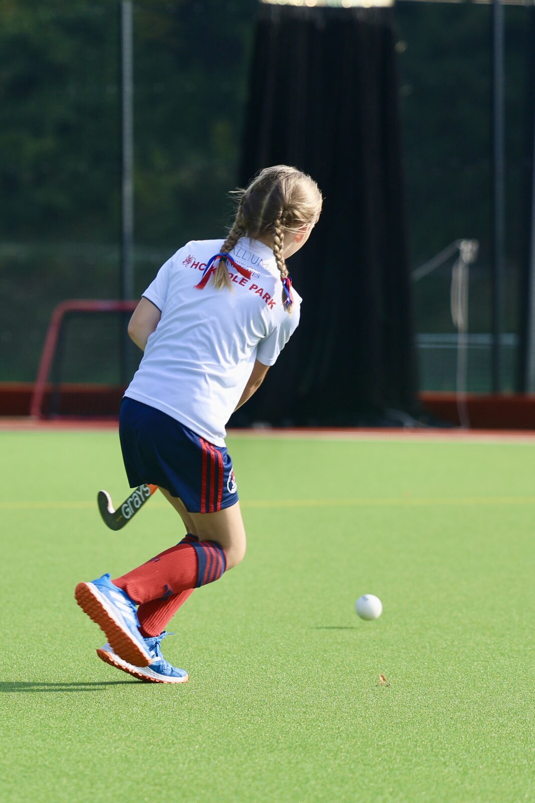 Away she goes — braids flying on a run towards goal