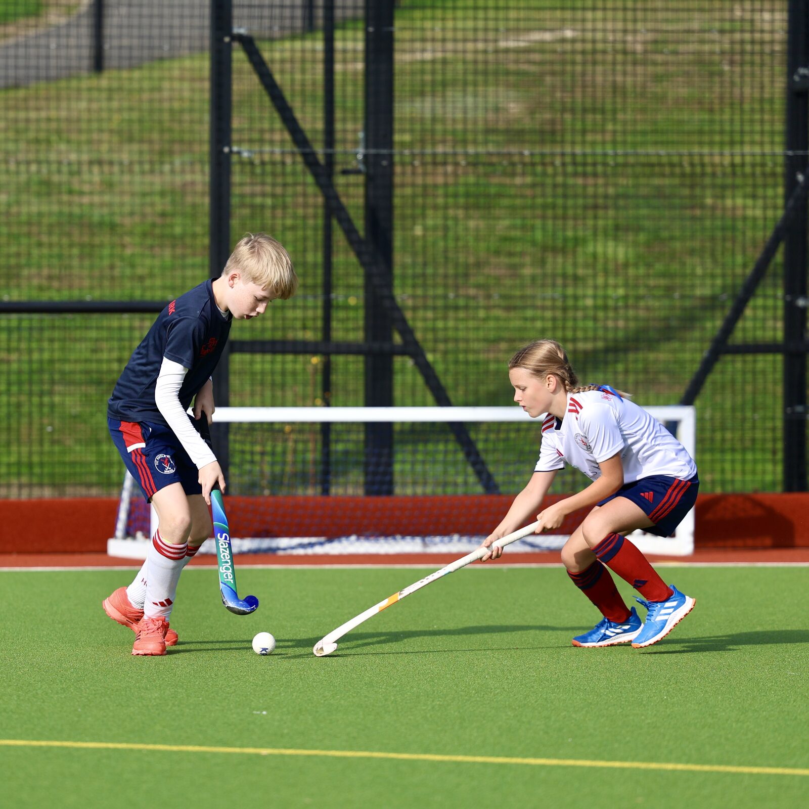 Two HC Knole Park juniors contesting the ball in front of goal at the Saturday mix-in