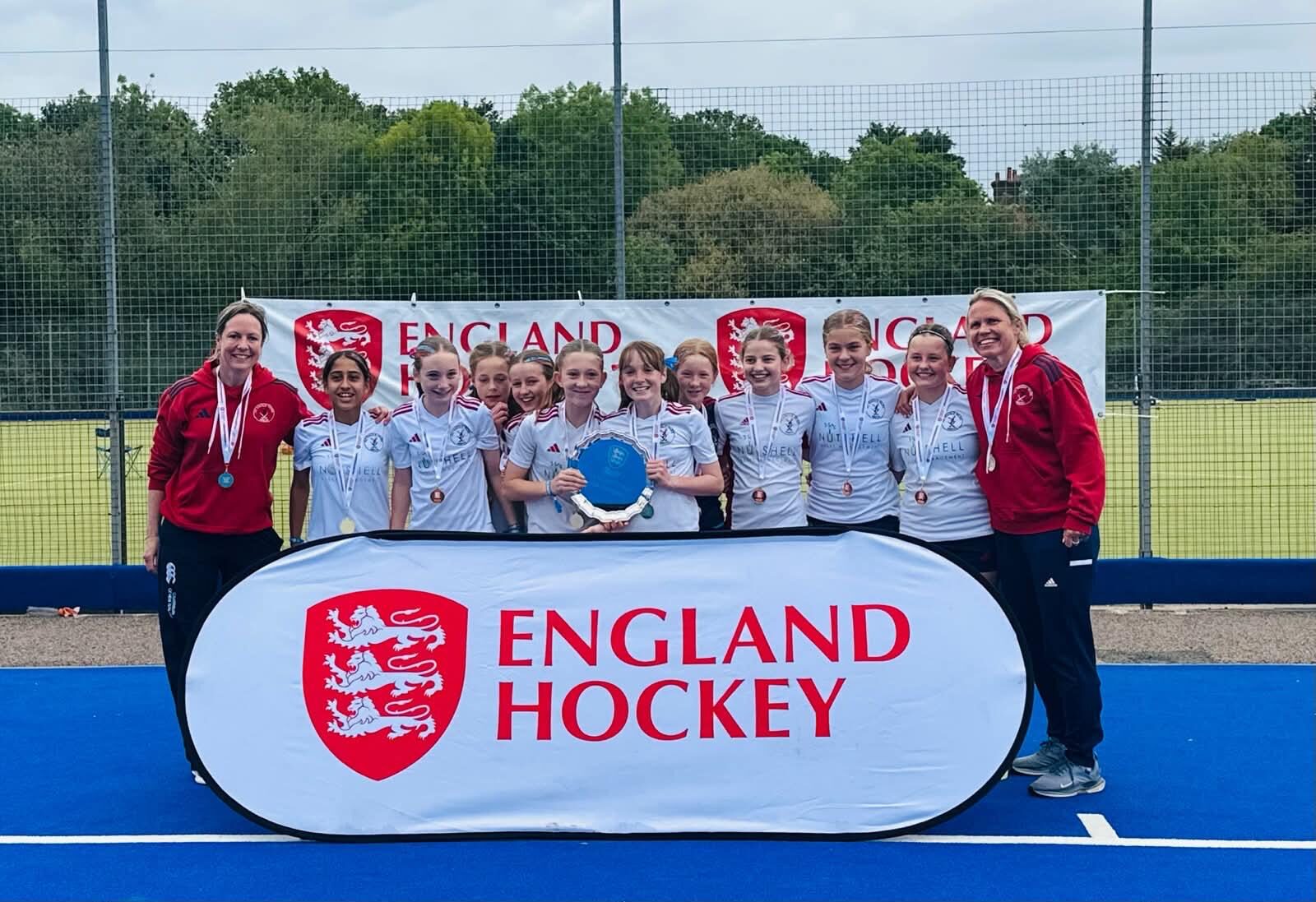 Junior champions celebrating with medals